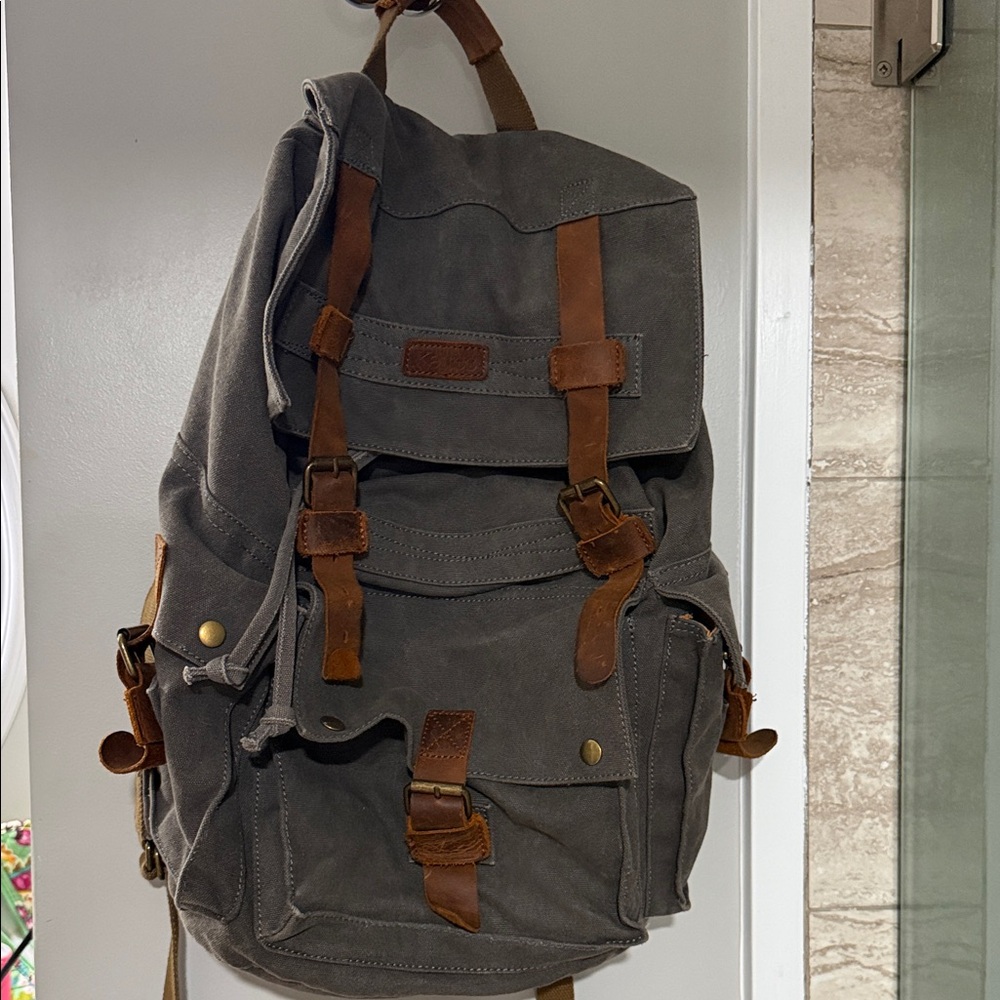 Stylish Gray Canvas Backpack with Brown Accents